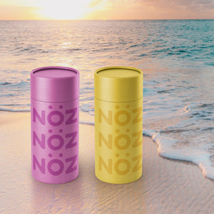 NÖZscreen in yellow and purple on the beach.